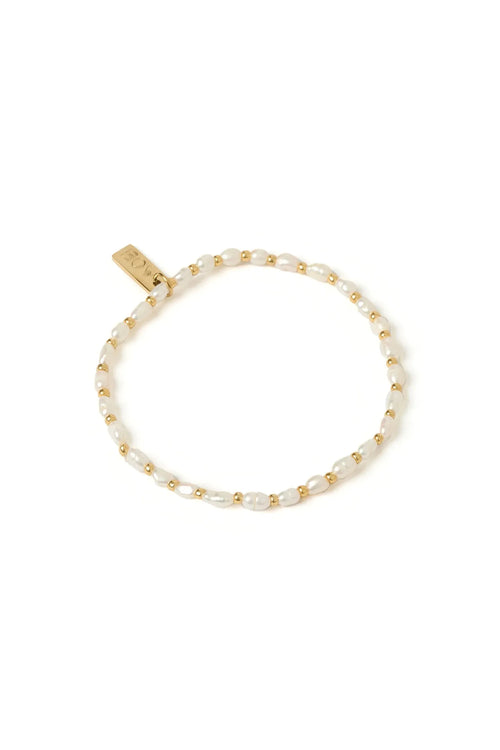 Pearl bracelet with gold beads on a white background