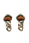 Gold earrings with brown gemstones on a white background