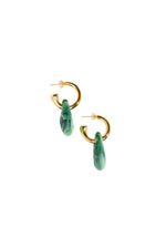 Gold hoop earrings with green teardrop charms on a white background