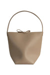 Beige handbag with a bow on a white background