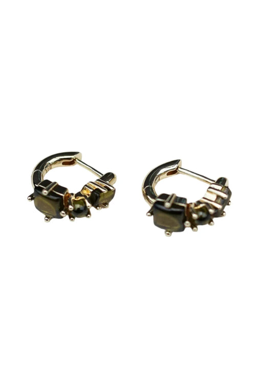 Pair of gold hoop earrings with gemstones on a white background