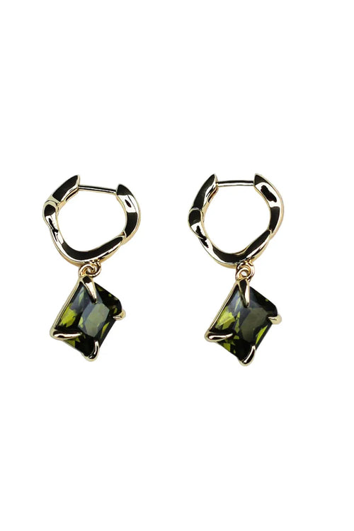 Gold hoop earrings with green gemstones on a white background