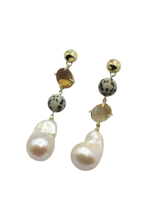 Pair of pearl and dalmatian jasper earrings on a white background