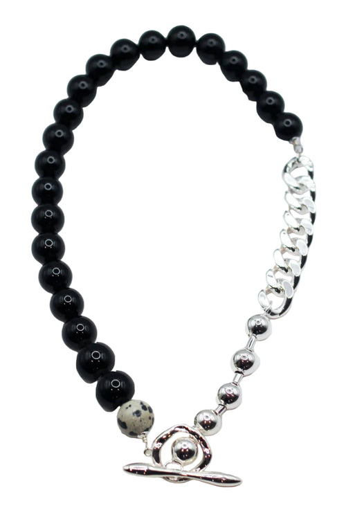 Black beaded bracelet with a silver clasp on a white background