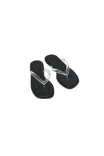 Black sandals with clear straps on a white background