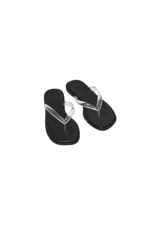 Black sandals with clear straps on a white background