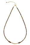 Necklace with brown and gold beads on a white background