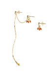 Gold earring set with coral beads on a white background