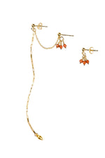 Gold earring set with coral beads on a white background