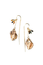 Pair of gold shell earrings with green accents on a white background