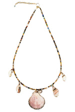 Necklace with shell and bead charms on a white background