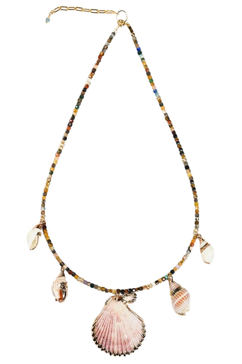 Necklace with shell and bead charms on a white background