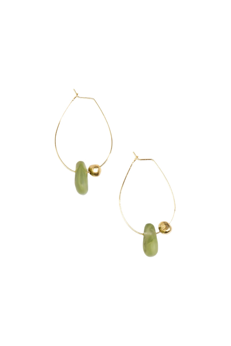 Gold hoop earrings with green beads on a white background
