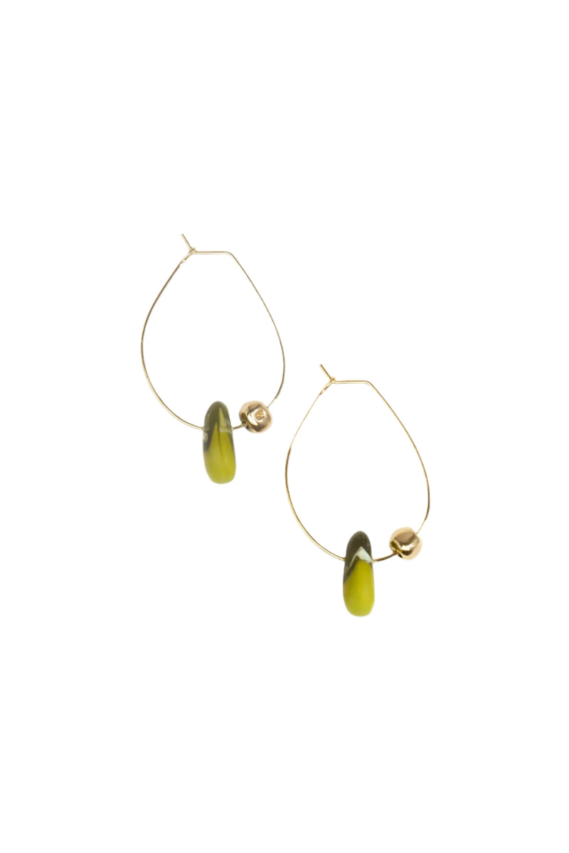 Gold hoop earrings with green beads on a white background