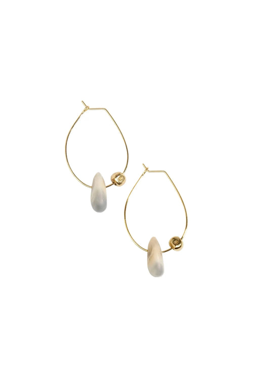 Gold hoop earrings with beige stones on a white background