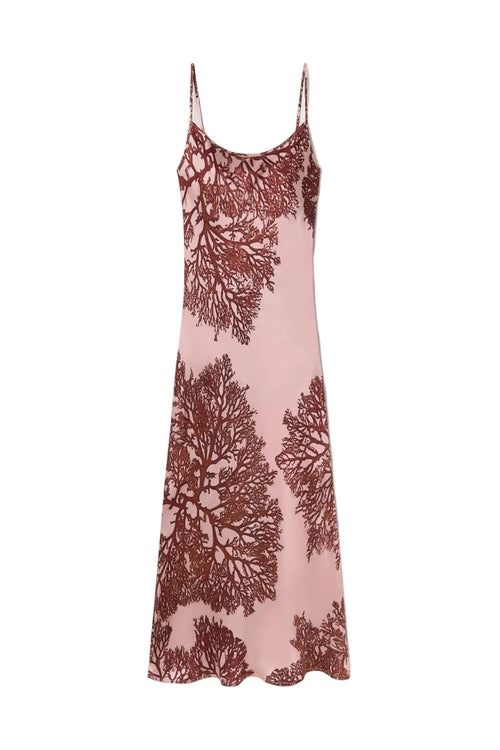 Pink slip dress with coral pattern on a white background