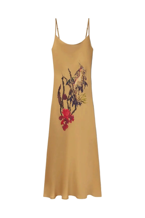 Mustard yellow slip dress with floral and animal print on a white background