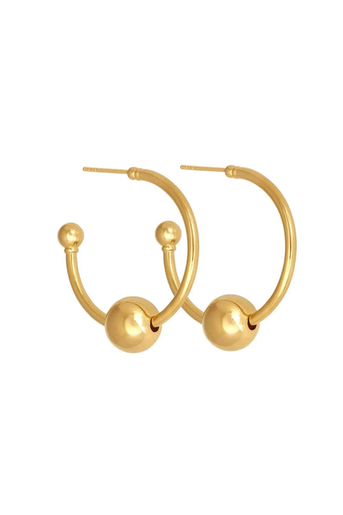 Gold hoop earrings with spherical ends on a white background