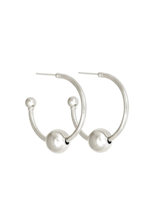 Silver hoop earrings with spherical ends on a white background