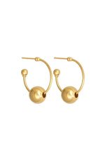 Gold hoop earrings with spherical ends on a white background