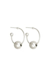 Pair of silver hoop earrings with spherical ends on a white background
