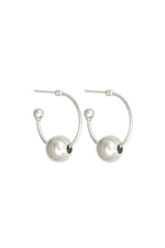 Pair of silver hoop earrings with spherical ends on a white background