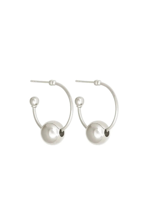 Pair of silver hoop earrings with spherical ends on a white background