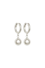 Silver hoop earrings with pearl-like drop charms on a white background