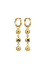 Gold hoop earrings with dangling gemstones on a white background