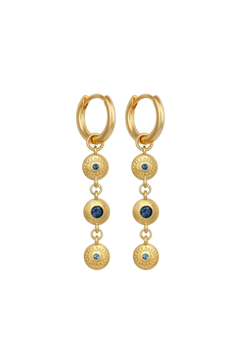 Gold hoop earrings with dangling gemstones on a white background