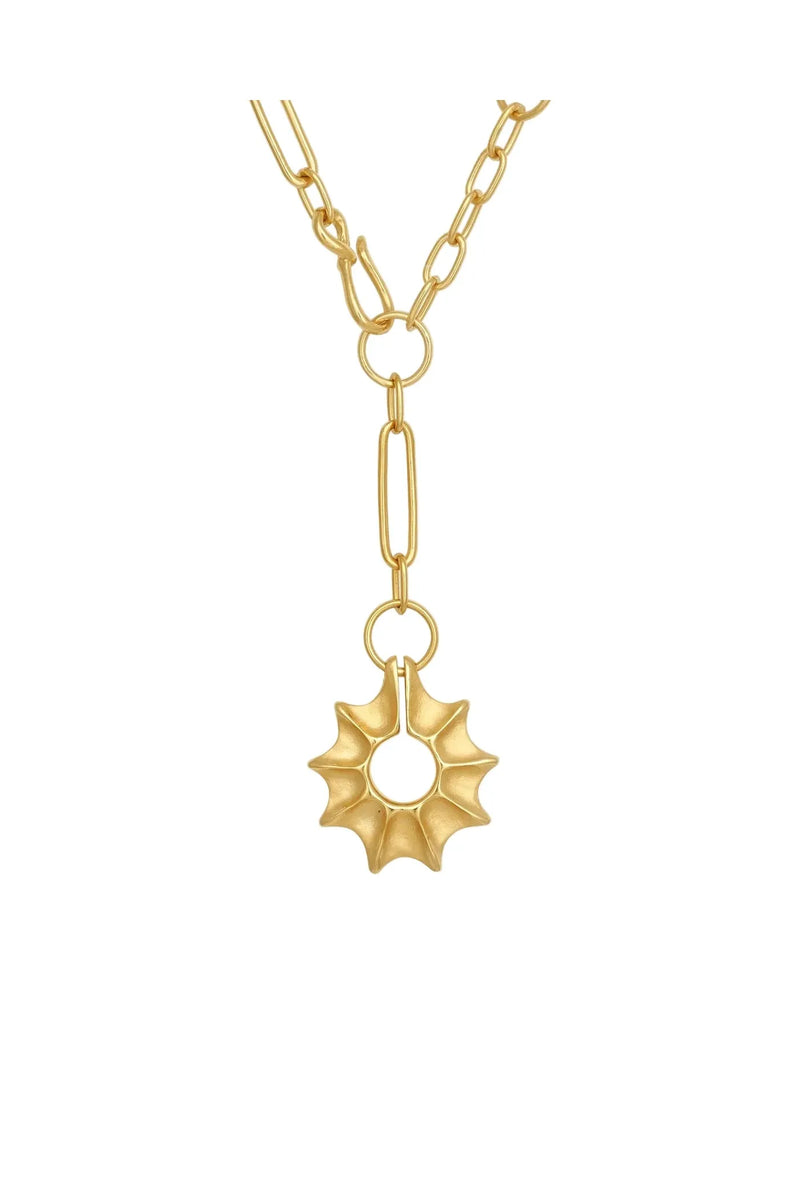 Gold necklace with a star-shaped pendant on a white background