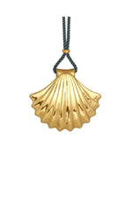 Gold scallop shell pendant on a blue cord against a white background