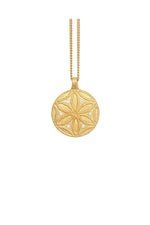 Gold necklace with a detailed pendant on a white background